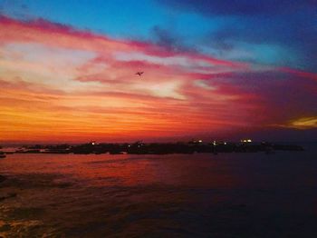 Scenic view of sea against dramatic sky