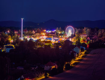 High angle view of illuminated buildings in city at night