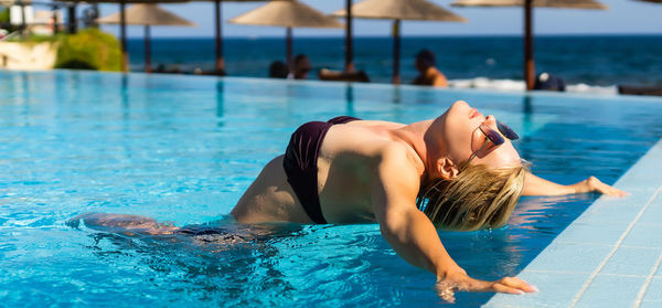 Woman swimming in pool