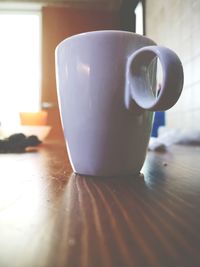 Close-up of coffee cup on table