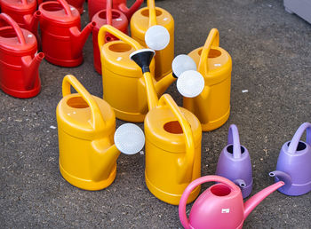 Garden multicolored plastic watering cans.