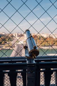 Close-up of chainlink fence against sky