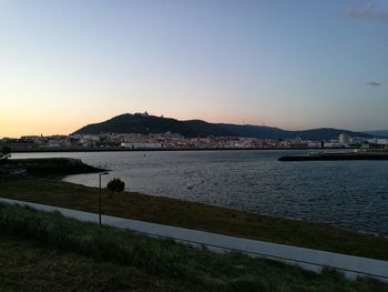 Scenic view of sea against clear sky during sunset