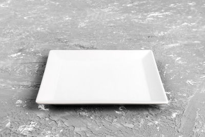 High angle view of water on table against white wall