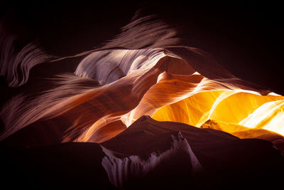 Low angle view of rock formations at night