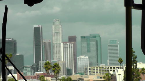 Skyscrapers in city against sky