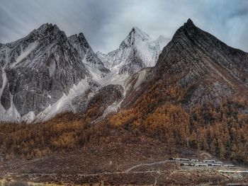 Scenic view of snowcapped mountains against sky