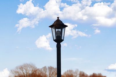 Low angle view of street light against sky