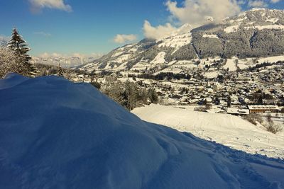 Scenic view of snow covered mountains against sky