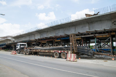 Cars on road against sky