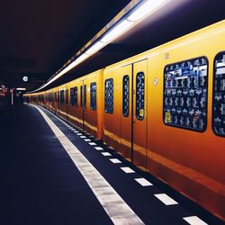 Train at illuminated subway station