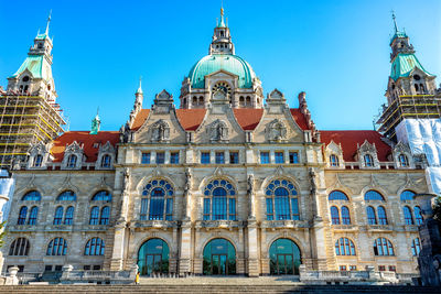 Low angle view of building against blue sky