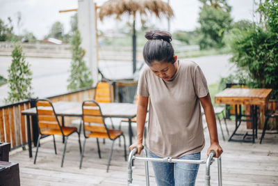 Full length of woman standing on table