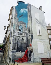 People outside temple in building