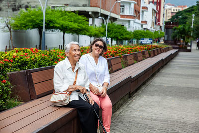 Senior mother and daugther travelling togeher. senior adults in cali colombia. senior lifestyle. 