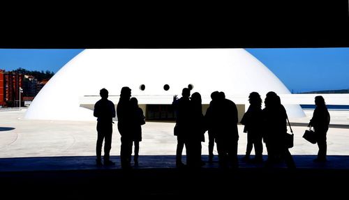 Silhouette of people looking at view