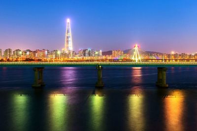Illuminated buildings at waterfront