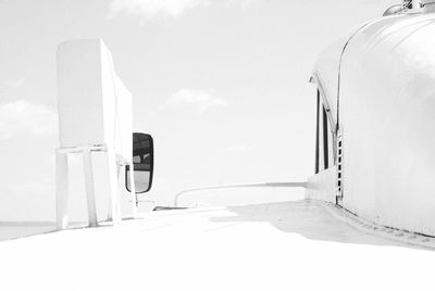 White ship moored against clear sky