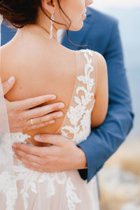 Close-up of couple embracing outdoors