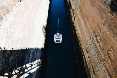 Aerial view of boat sailing in river