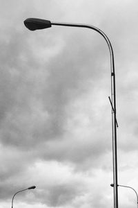 Low angle view of street light against sky