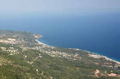 High angle view of land and sea against sky