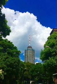 Low angle view of buildings against cloudy sky