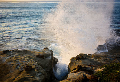 Waves splashing on rocks at shore