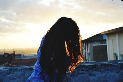 Beautiful woman dreaming of paradise in sunlight