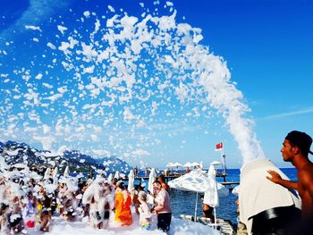 Crowd in blue sky