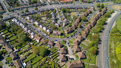 High angle view of trees and buildings in city