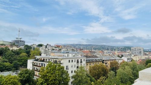 Buildings in city against sky