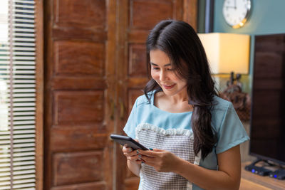 Young woman using mobile phone