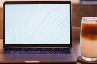 Close-up of laptop on table