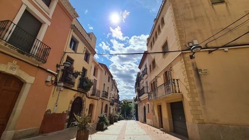 Narrow street amidst buildings in town