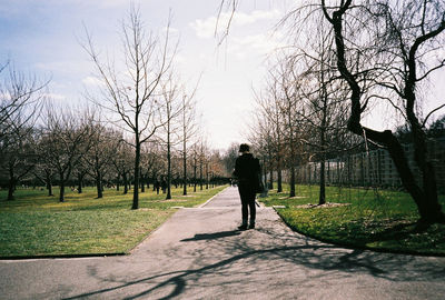 Woman walking on footpath