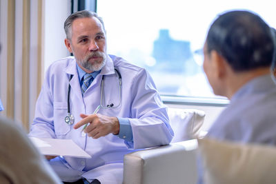 Doctor examining patient at clinic