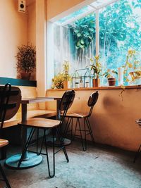 Empty chairs and tables in building