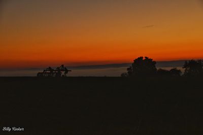 Silhouette people on beach during sunset