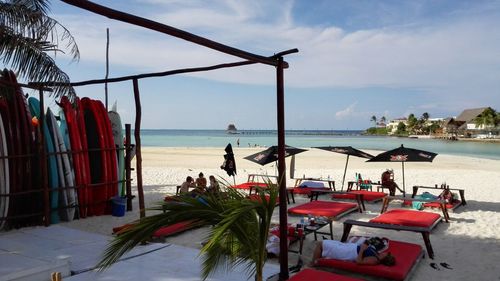 View of lounge chairs on beach