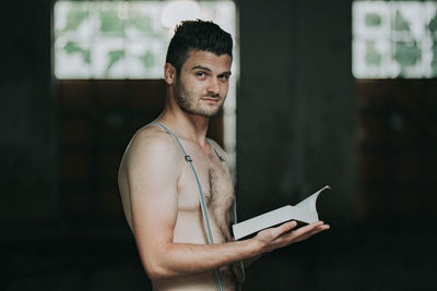 Portrait of young man standing outdoors