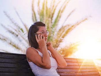 Portrait of talking on phone at park