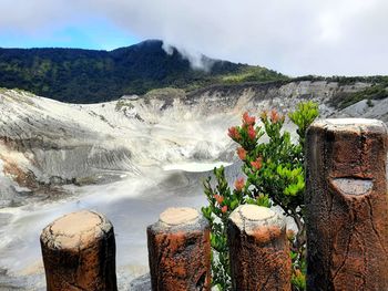 Panoramic view of waterfall against sky