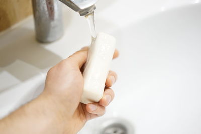 Close-up of woman hand in bathroom