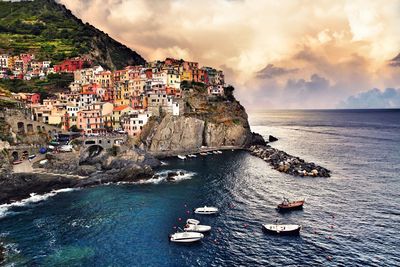 Panoramic view of townscape by sea against sky