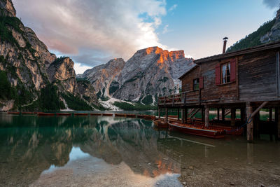 Panoramic shot of lake and houses against sky