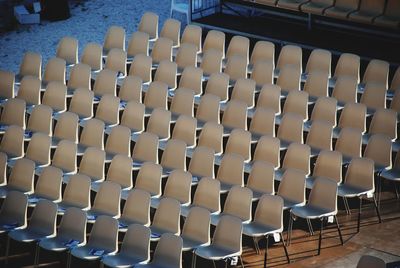 High angle view of chairs in row