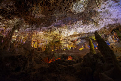 Low angle view of illuminated cave