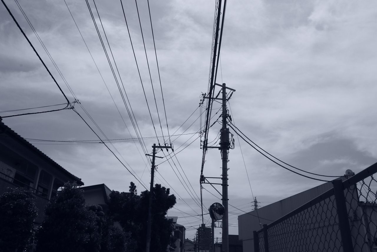 power line, electricity pylon, cable, sky, power supply, electricity, low angle view, connection, cloud - sky, building exterior, built structure, architecture, cloudy, fuel and power generation, cloud, technology, power cable, outdoors, day, no people