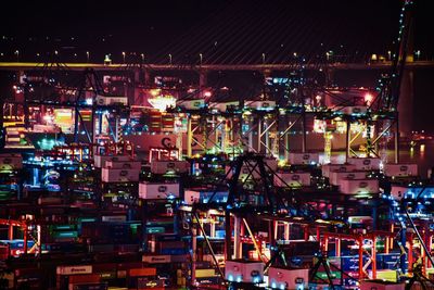 Aerial view of illuminated city at night